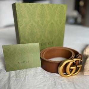 Woman’s brown Gucci belt